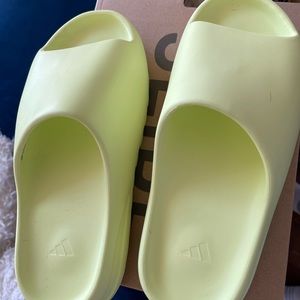 Glow green Yeezy slides